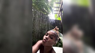 janelle monae -  A slutty mulatto in a beautiful swimming costume poses for the camera