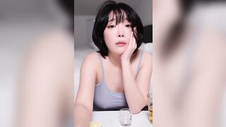 inkyung -  Young Asian girl sweetly chatting and teasing in front of the camera