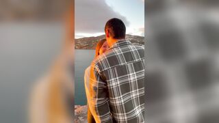 zhanet filipova - A young couple filming themselves on camera with a beautiful view