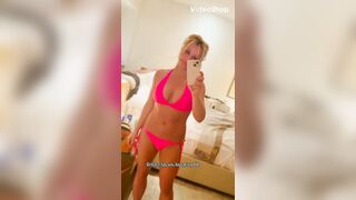 britney spears - Milfochka in a beautiful swimming costume teases in front of the camera