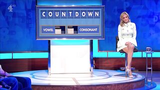 rachel riley - Blondie in a dress plays a game show and wins.